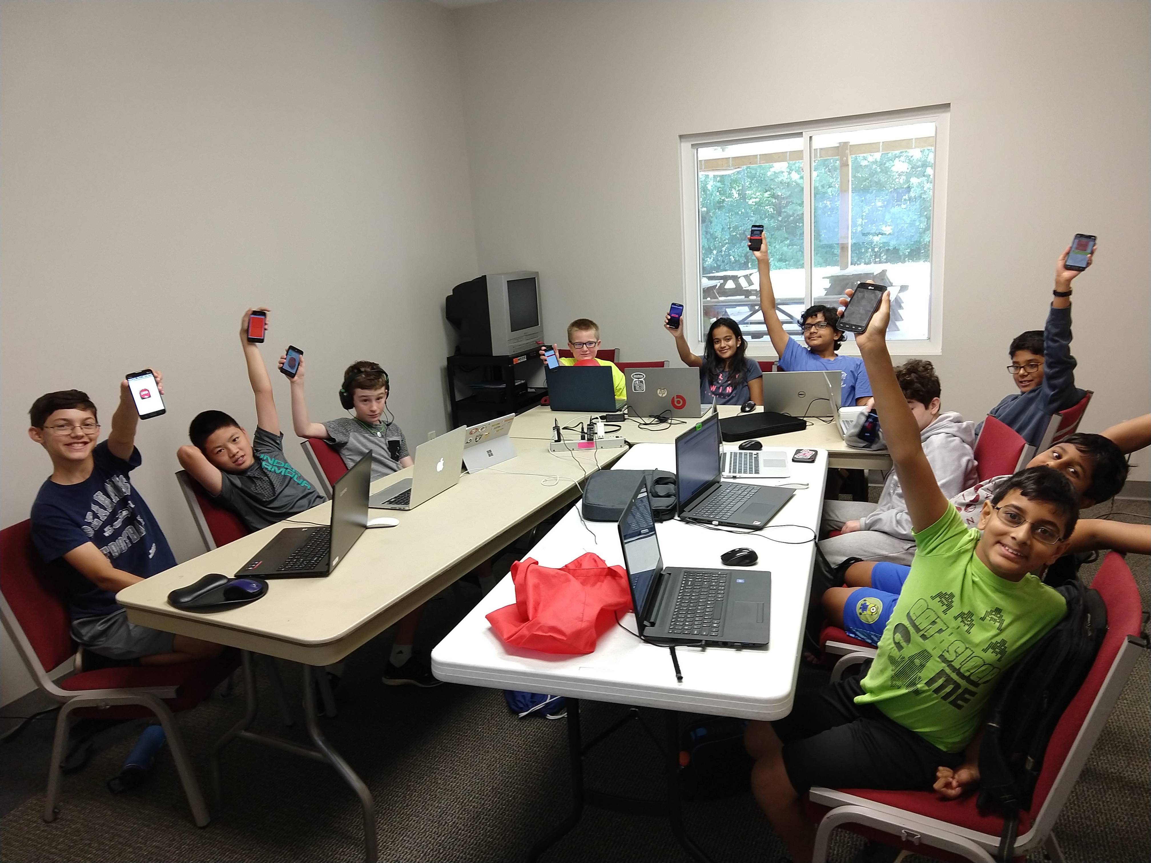 students holding phones